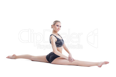 Lovely flexible girl posing sitting on splits