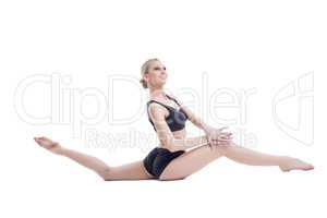 Happy athletic girl doing stretching exercises