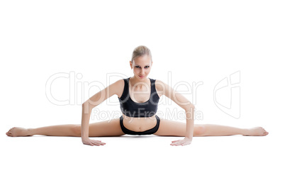 Pretty flexible woman doing stretching exercises