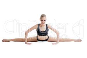 Pretty flexible woman doing stretching exercises