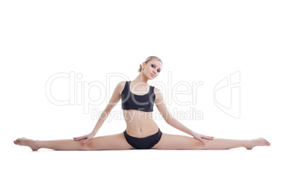 Image of cute flexible gymnast sitting on splits