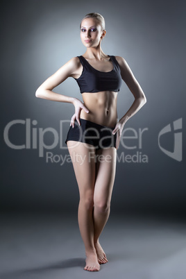 Image of comely sporty woman posing at camera