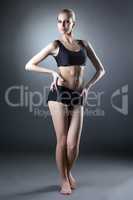 Image of comely sporty woman posing at camera