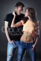 Attractive young couple posing in casual clothes