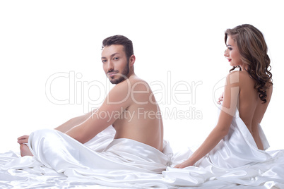 Attractive sexual partners posing in bed