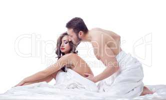 Intimacy of two beautiful persons posing in bed