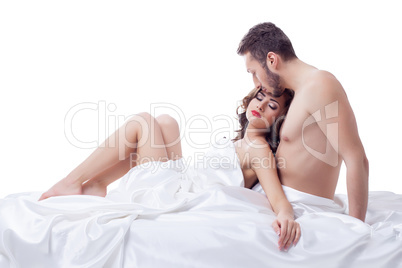 Pleased pretty woman lying in arms of her lover