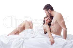 Pleased pretty woman lying in arms of her lover