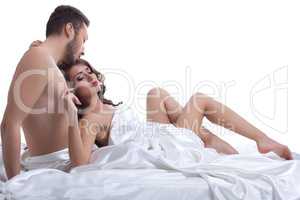 Image of beautiful young lovers lying in bed