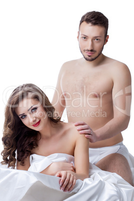 Happy charming woman in bed with handsome lover