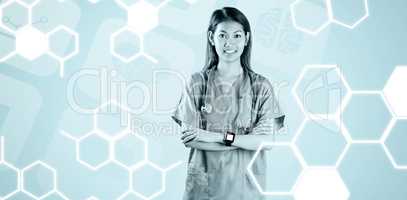 Composite image of asian nurse with arms crossed