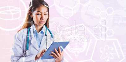 Composite image of asian doctor using tablet