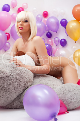 Sexy platinum blonde posing nude in studio