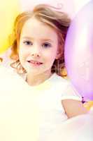 Portrait of beautiful girl posing with balloons
