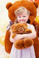 Charming little girl hugging favorite toy