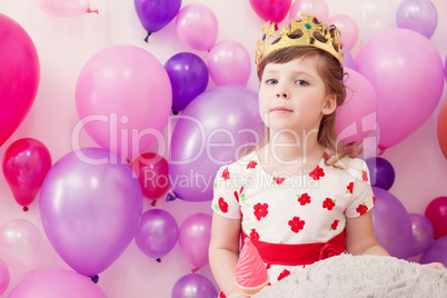 Portrait of funny girl posing in toy crown