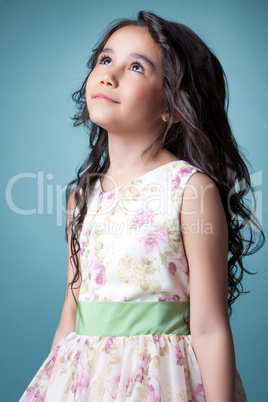 Image of nice little girl posing looking up