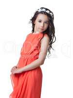 Adorable little model posing in stylish red dress