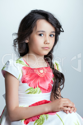 Charming dark-haired girl posing at camera