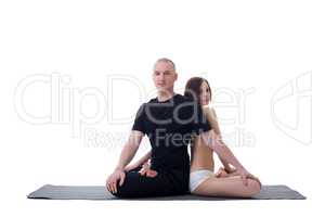 Handsome yoga couple posing in lotus position