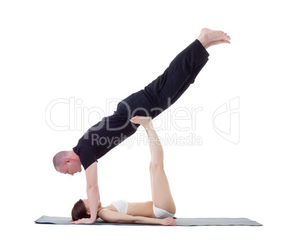 Studio shot of athletic trainers practicing yoga