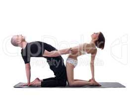 Couple of yoga instructors isolated on white