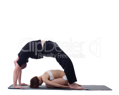 Image of flexible trainers practicing yoga
