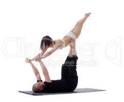 Pair of flexible athletes doing yoga exercises