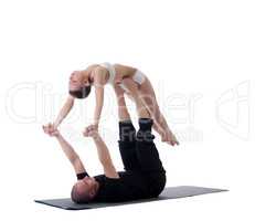 Image of healthy couple posing in yoga position