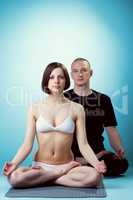 Image of healthy yoga instructors posing at camera