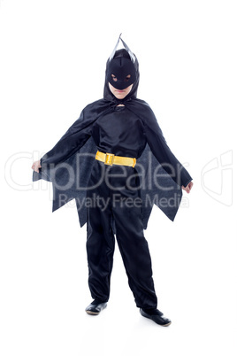 Studio shot of cute boy dressed as Batman