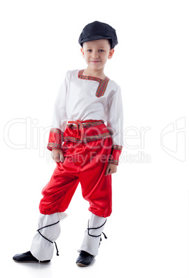 Funny blonde boy posing in rustic costume