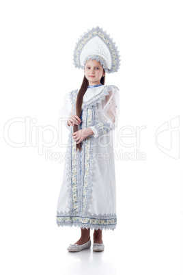 Cute girl posing in luxurious dress with kokoshnik