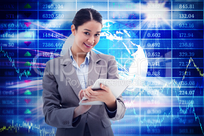 Composite image of portrait of a smiling businesswoman using a t