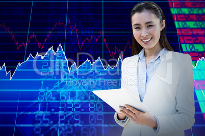 Composite image of smiling businesswoman writing on notepad