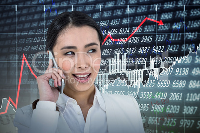Composite image of businesswoman using her smart phone
