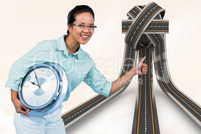 Composite image of delighted businesswoman holding a clock