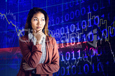 Composite image of serious businesswoman holding her chin