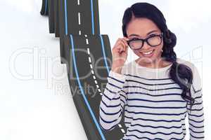 Composite image of smiling asian woman holding eyeglasses