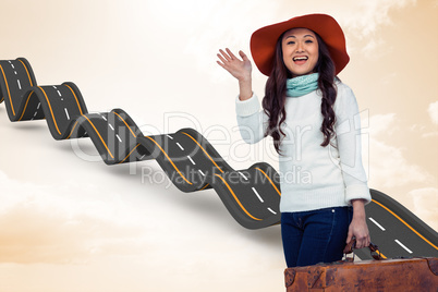 Composite image of asian woman with hat holding luggage