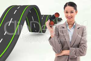 Composite image of portrait of a businesswoman holding binocular