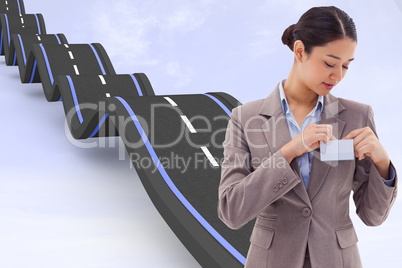 Composite image of portrait of a businesswoman clipping her badg