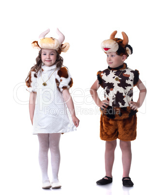 Funny little kids posing in carnival costumes
