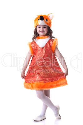 Smiling little girl posing dressed as fox