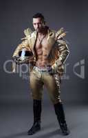 Studio shot of hot muscular man in golden costume