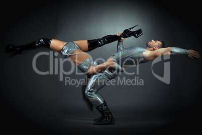 Flexible athletic dancers posing at camera