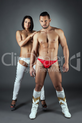 Couple of sexy stripped dancers posing at camera