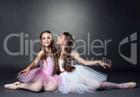 Two beautiful young ballerinas posing at camera