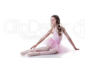 Dreamy young ballerina isolated on white backdrop