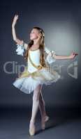 Image of elegant young ballerina posing at camera